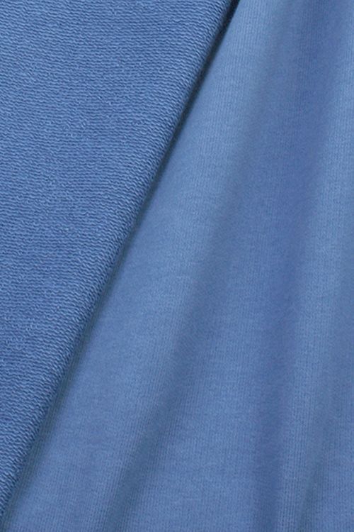 Close-up of french terry fabric showing the looped-back structure.