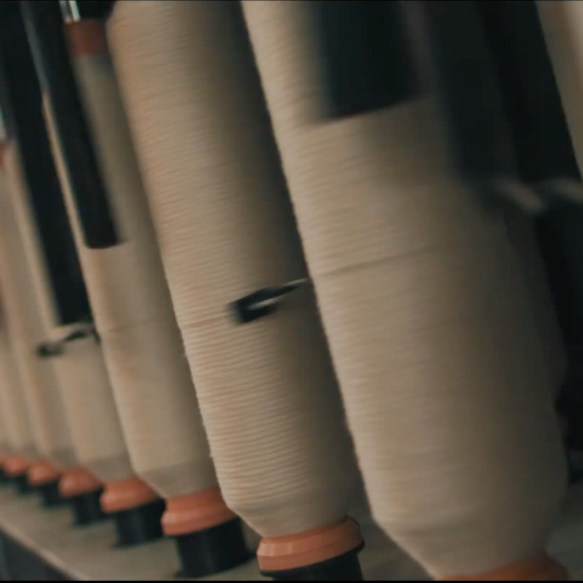 Cotton yarn on the spinning frames at the mill.