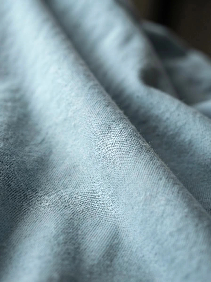 Organic cotton single jersey draped to show its weight and drape.